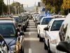 Police vehicles from Charleston and several different agencies take up two lanes of Virginia Street for the visitiation of slain Charleston Patrolman Jerry Jones Tuesday afternoon. Bob Wojcieszak/Daily Mail